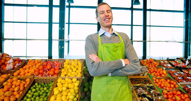 Man at che counter vegetables