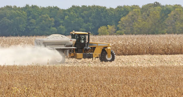 Tractor spreading it lime